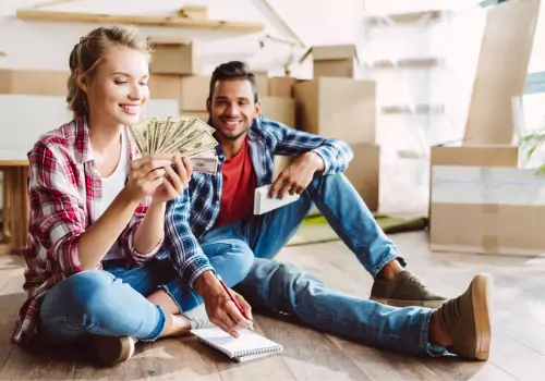 young-couple-counting-money